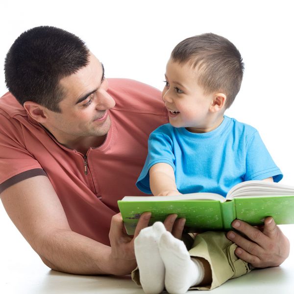 Dad and son reading book